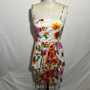 Betsey Johnson White dress with flowers and a peplum.